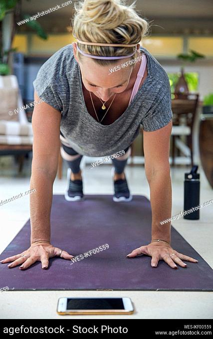 Woman doing Plank Position at home