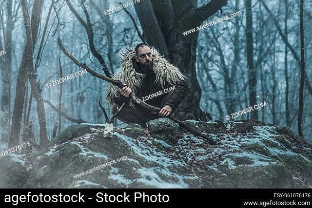 Shamanic man in the nature, winter landscape
