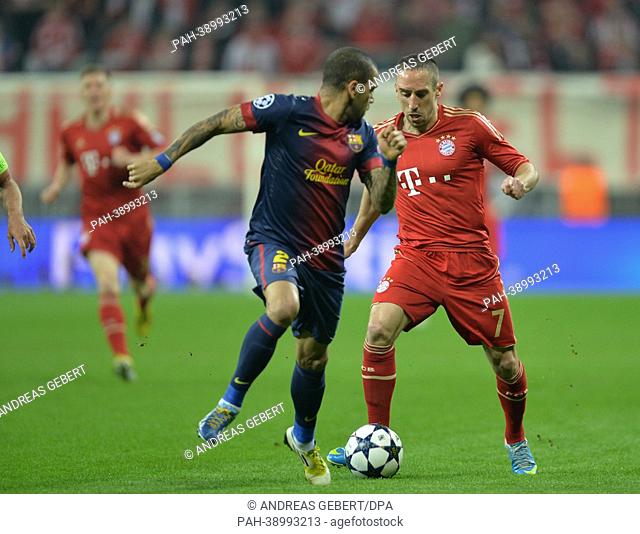 Munich's Franck Ribery (R) and Barcelona's Daniel Alves vie for the ball during the UEFA Champions League semi final first leg soccer match between FC Bayern...