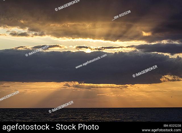 Sunbeams behind clouds, dramatic evening sky, sunset on the Baltic Sea, Öland Island, Sweden, Europe