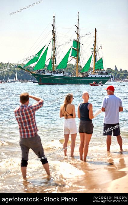 24 June 2023, Schleswig-Holstein, Kiel: Led by the sail training ship ""Alexander von Humboldt II"", boats, sailors and traditional sailing vessels sail the...