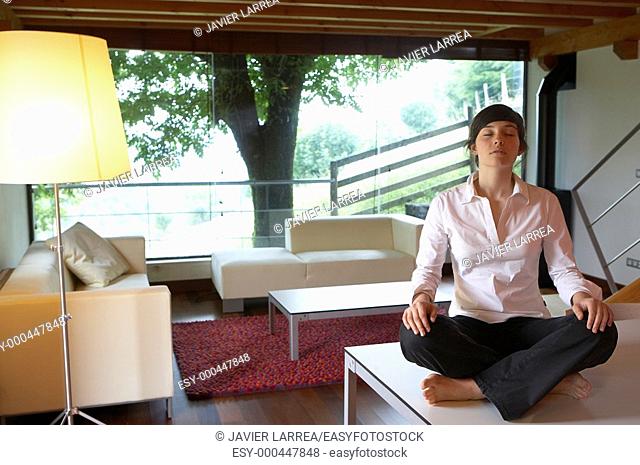 Young girl in rural hotel, yoga