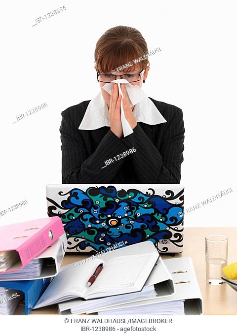 Woman with a cold at work