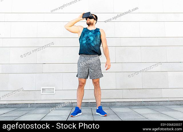 young man in sports clothes with vr glasses