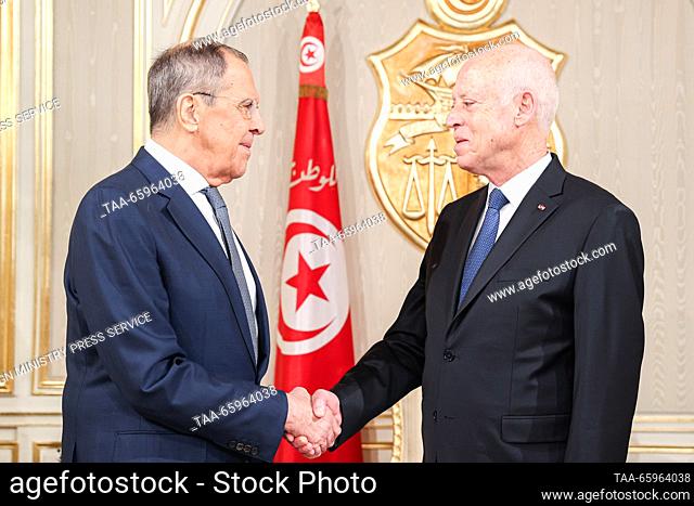 TUNISIA, TUNIS - DECEMBER 21, 2023: Russia's Foreign Minister Sergei Lavrov (L) and Tunisia's President Kais Saied shake hands during a meeting