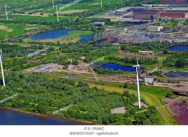 aerial view of the plants of the steel mill Arcelor Mittal with green areas and wind wheels in between, Germany, Bremen
