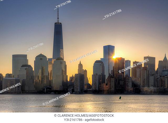 The sun rises next to 4 World Trade Center as the Freedom Tower 1 WTC stands tall nearby in the World Trade Center complex, in New York City, New York, USA
