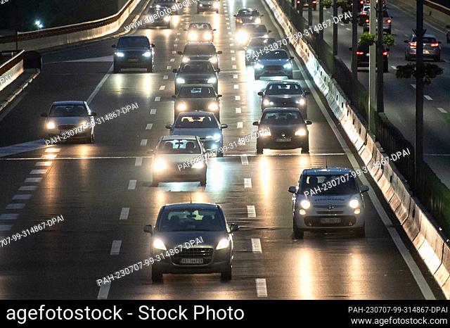 SYMBOL - 06 July 2023, Serbia, Belgrad: Numerous cars drive along Bulevar Vojvode Putnika in the twilight. Photo: Silas Stein/dpa. - Belgrad/Serbia