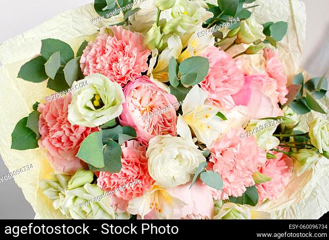 beautiful bouquet made of different flowers with in woman hand . colorful color mix flower