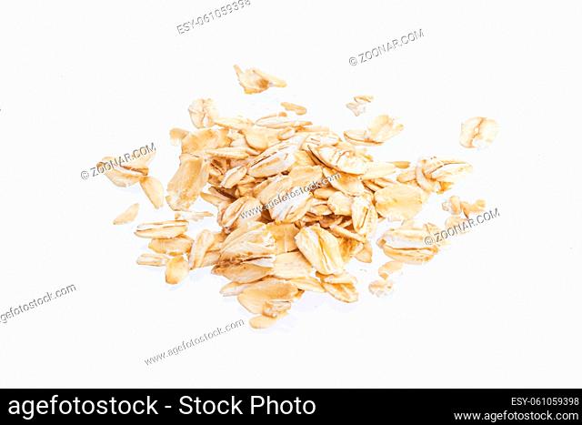 Oat flakes isolated on white background. Top view. Close up