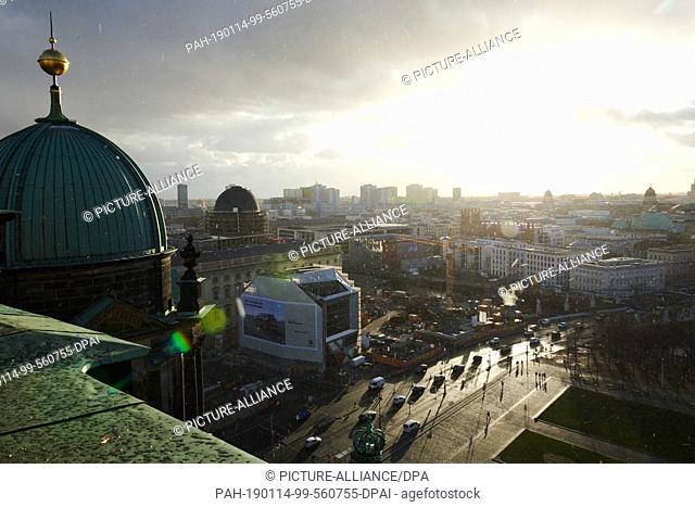 14 January 2019, Berlin: The view from the Berlin Cathedral in Berlin Mitte. The wet roofs of the capital reflect the sunlight
