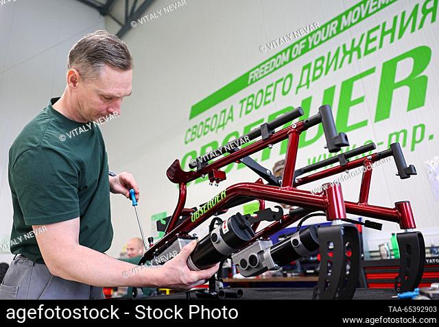 RUSSIA, KALININGRAD REGION - DECEMBER 1, 2023: An employee works in an assembly room at the Observer wheelchair factory in the village of Poddubnoye