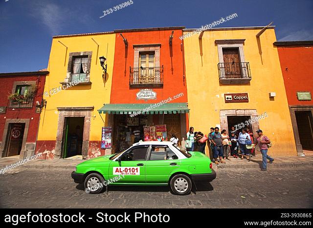 People in front the colonial buildings with balcony at the historic center, San Miguel de Allende, Guanajuato state, Mexico, Central America
