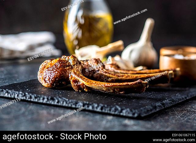 Grilled lamb chops on cutting board