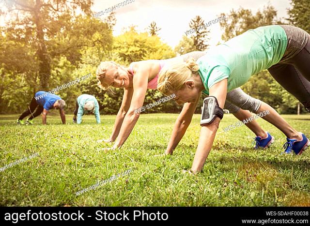 Pushups on a meadow in a park