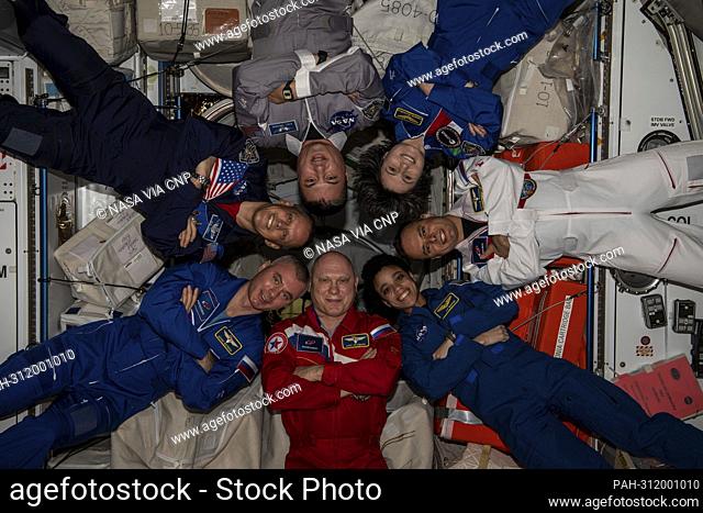 The seven-member Expedition 67 crew poses for a portrait inside the International Space Station's Harmony module on August 18, 2022