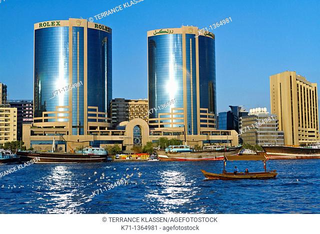 The Dubai Creek skyline office towers with Dow boats in Dubai, UAE, Persian Gulf