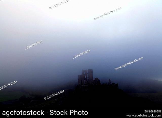 Norman dark ages castle ruin in dorset england in thick sea mist