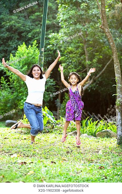 Mother and daughter jumps