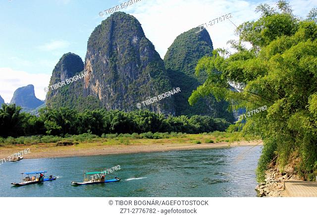 China, Guangxi, Xingping, Li River, karst landscape, limestone hills, boats, people,