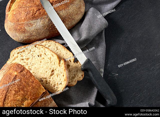 homemade craft bread with kitchen knife
