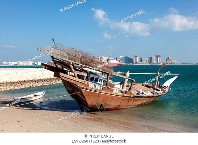 Traditional fishing dhow in the beach in Bahrain, Middle East