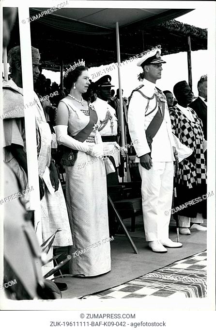 Nov. 11, 1961 - Daily Herald. London. Finger. The Royal Tour of West Africa.: The Queen and the Duke of Edinburgh watching a procession of chiefs and their...