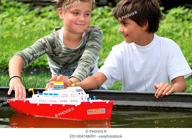 Children playing with boat