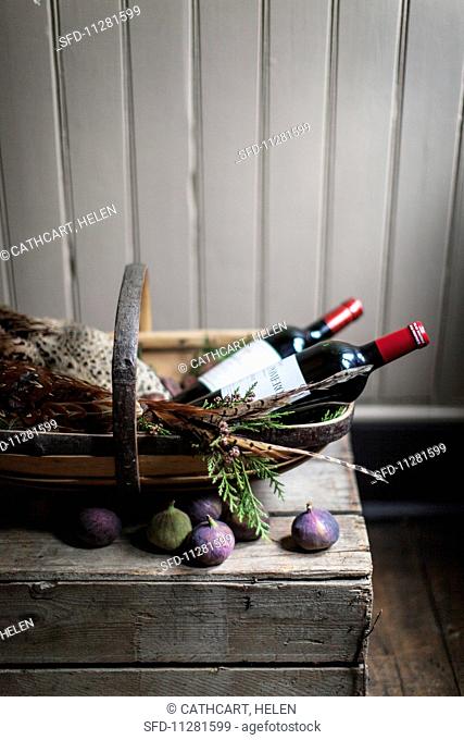 An arrangement featuring pheasant, red wine and figs