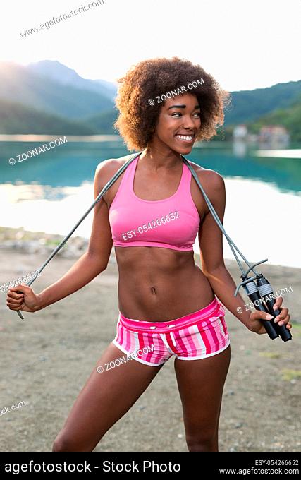 portrait of afro american woman with jump rope