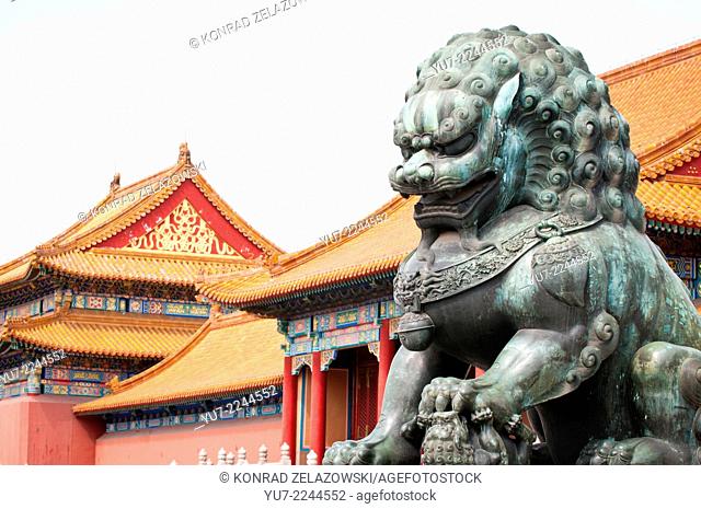 Traditional guardian lion bronze statue in front of Gate of Supreme (Great) Harmony in Forbidden City, Beijing, China