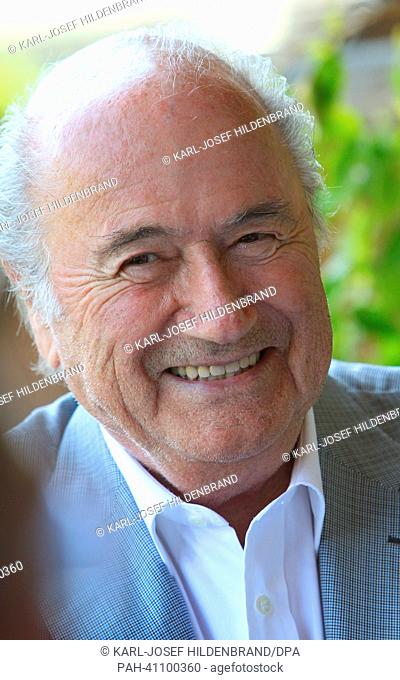 FIFA presiddent Sepp Blatter laughs during the 'Camp Beckenbauer' in Going, Austria, 17 July 2013. The forum deals with the future of the sport