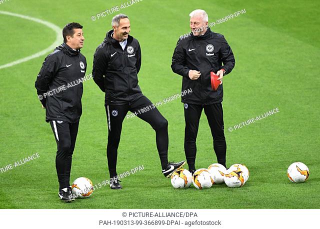 13 March 2019, Italy, Mailand: Adi Hütter (M), head coach of Eintracht Frankfurt, and the two co-trainers Armin Reutershahn (r) and Christian Peintinger take...