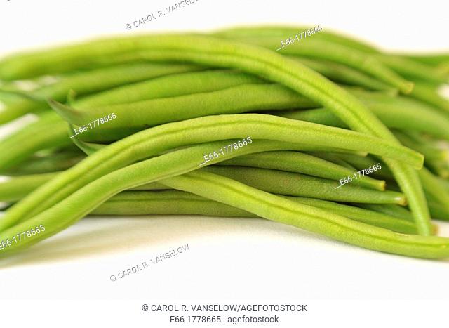 Haricot verts green beans on white background Shot with Lensbaby for selective focus