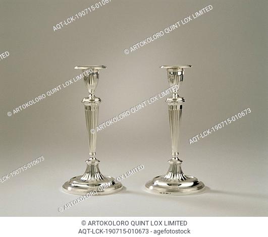 Candlestick with the Clifford family crest, The oval candlesticks with loose fat traps rest on a base, which is made up of two arched sections above a...