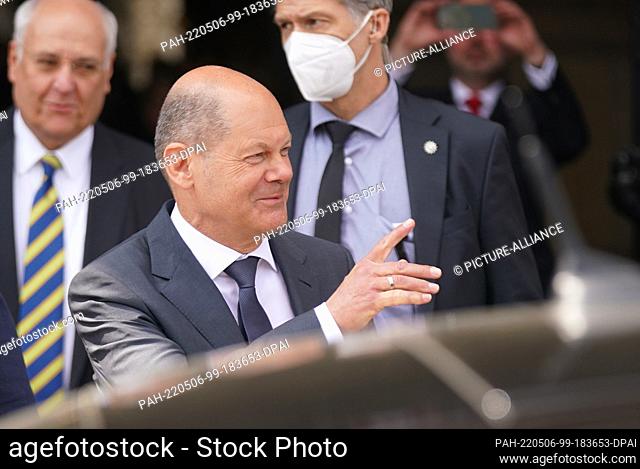 06 May 2022, Hamburg: Chancellor Olaf Scholz (SPD) walks out of City Hall after the ""100 Years of the Ìbersee Club"" celebration