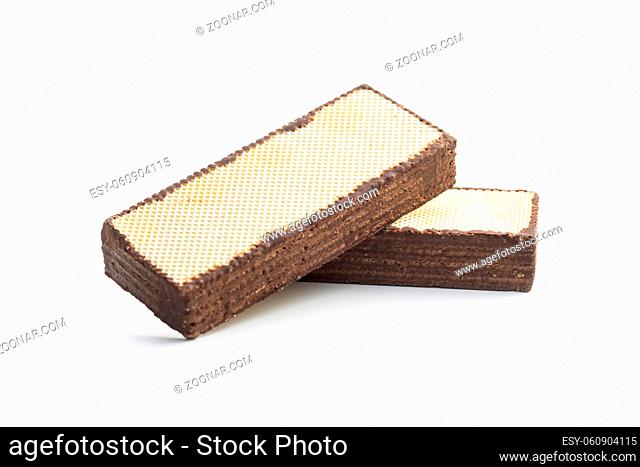 Crispy wafer biscuits filled with chocolate cream isolated on white background