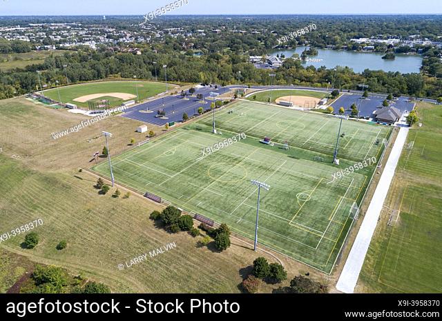 Aerial view of a high school playfield with baseball diamonds and a football field in Glenview, IL. USA