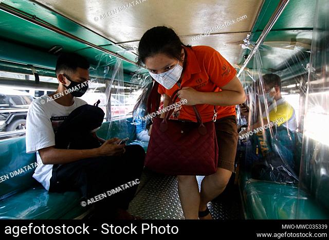 A passenger prepares to ride a modified traditional jeepney along Araneta Avenue Quezon City. The traditional jeepneys are allowed to travel but limited only to...