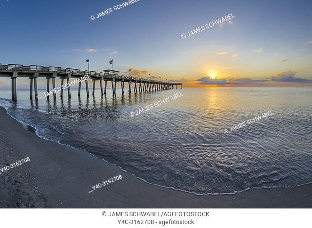 Fishing pier on Gulf of Mexico at sunset in Venice Florida