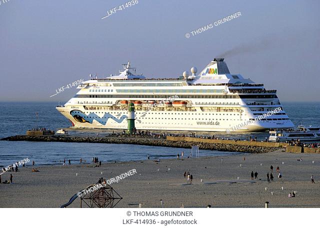 Cruise ship leaving the harbour of Warnemuende, Rostock, Baltic coast, Mecklenburg Western Pomerania, Germany, Europe