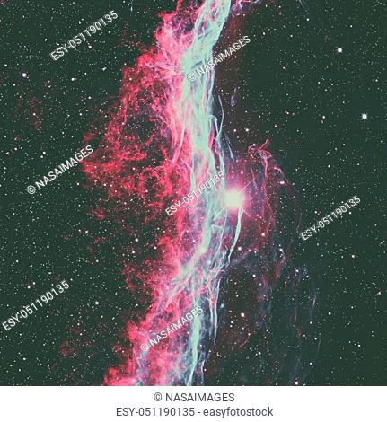 The Veil Nebula or The Witch's Broom Nebula is a cloud of heated and ionized gas and dust in the constellation Cygnus. Retouched colored image