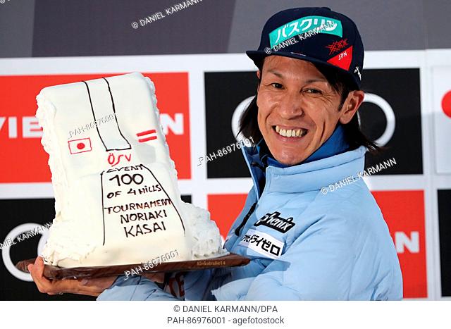 Japan's Noriaki Kasai celebrates with a cake after his jump from the Bergisel ski jump in the men's 1st run at the Four Hills Tournament ski jumping World Cup...