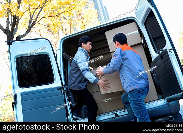 Logistics personnel handling the goods