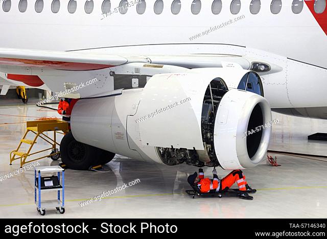 RUSSIA, MOSCOW REGION - FEBRUARY 1, 2023: An employee runs a check on a Sukhoi Superjet 100 (SSJ100) aircraft's engines at a maintenance hangar of the Red Wings...