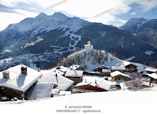 France, Savoie, Montvalezan, the Chatelard 1550m and the chapel of Saint Michel, High Tarentaise overlooking the National Park of La Vanoise and Les Arcs ski...
