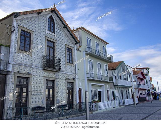 Street in Costa Nova with 'Palheiiros"" typical Streeped Colorful houses, Aveiro, Portugal