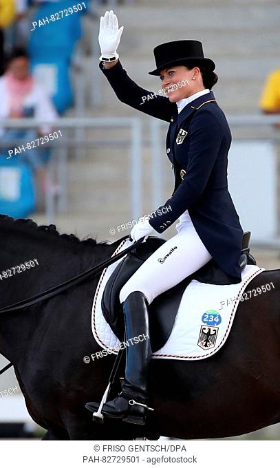 Kristina Broering-Sprehe of Germany on horse Desperados FRH reacts after performing during the Dressage Individual and Team Grand Prix Special of the Equestrian...