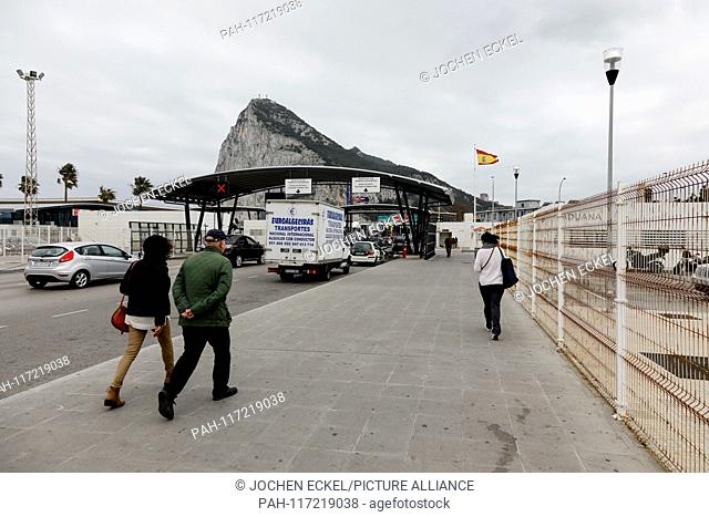 People walk to the border between Spain and Gibraltar, 14 February 2019..Gibraltar is waiting to see how Britain's future departure from the European Union...
