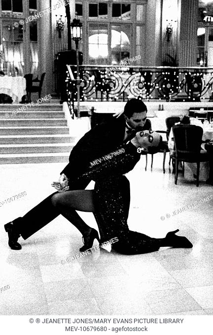 Ballroom dancing couple in a passionate pose at the Waldorf